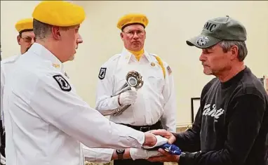  ?? Dave Roberts / Contribute­d photo ?? Riverton American Legion Post #159 Color Guard retires the American flag for April Veteran of the Month and raise the American flag for May Veteran of the Month.