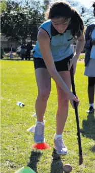  ??  ?? St Catherine’s School’s Kiara Coetzer working her way around the cones at the hockey station