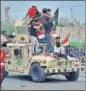  ??  ?? Protesters climb on top of an Iraqi Army vehicle during a rally in Basra, Iraq. AP