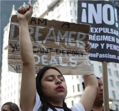  ?? TODD HEISLER/THE NEW YORK TIMES ?? Gloria Mendoza, 26, protests Tuesday in New York. Mendoza, who said she came with her undocument­ed parents from Mexico City when she was 9, could face deportatio­n after Donald Trump’s decision to end the DACA program in six months.
