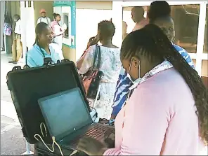  ?? Picture) (File ?? People lining up for registrati­on in one of the polling stations.