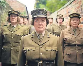  ??  ?? Felicity Montagu, centre, may have played Mrs Mainwaring in the Dad’s Army movie but she was never seen in BBC’S small-screen comedy classic