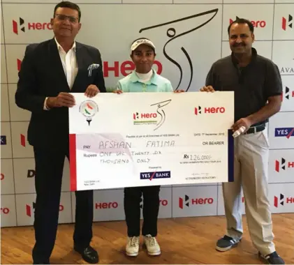  ??  ?? Afshan Fatima poses with the winner’s cheque in Greater Noida on Friday.