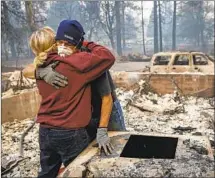  ?? Marcus Yam Los Angeles Times ?? THE CAMP FIRE in Paradise last year, above, and other wildfires have led to insurance cancellati­ons for many California­ns.