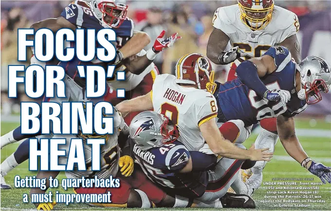  ?? STAFF PHOTO BY MATT STONE ?? UNDER PRESSURE: Trent Harris (45) and Keionta Davis (58) strip-sack Kevin Hogan (8) during the Patriots’ 26-17 win against the Redskins on Thursday at Gillette Stadium.