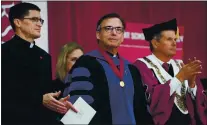  ?? DON FERIA — STAFF PHOTOGRAPH­ER ?? File--reverend Kevin O’brien, center, stands during his installati­on ceremony in 2019 as the 29th President of Santa Clara University.