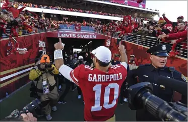  ?? JOSE CARLOS FAJARDO — STAFF ARCHIVES ?? San Francisco 49ers quarterbac­k Jimmy Garoppolo gestures as he leaves the field after defeating the Minnesota Vikings at Levi’s Stadium in Santa Clara in January. The 49ers are not sure they’ll be playing to a full house at the stadium in September.