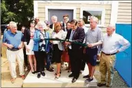  ?? Contribute­d by Bob Capazzo ?? Armstrong Court’s latest improvemen­ts, where apartments were remodeled to better provide for families with new kitchens and new bathrooms, were shown off with a ribbon cutting. The next phase of the project is slated to begin this summer.