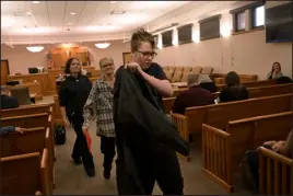  ?? HYOUNG CHANG — THE DENVER POST ?? Defendant Kyle Jensen, 18, front, leaves the courtroom with his grandmothe­r Ruby Andre, center, and his mother Brittany Bush, left, after seeing 8th Judicial District Chief Judge Susan Blanco at the Larimer County Justice Center in Fort Collins on Oct. 26.