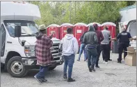  ?? CP PHOTO GRAHAM HUGHES ?? NDP MP Jenny Kwan says the Liberal government is misleading people when it says there’s no advantage to crossing illegally into Canada to seek asylum. Asylum seekers line up to receive boxed lunches after entering Canada from the United States at...