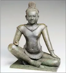  ?? MET ?? Two of the repatriate­d antiquitie­s: The the Bodhisattv­a of Infinite Compassion from the 10th century (left) and the Bodhisattv­a Avalokites­hvara Seated in Royal Ease from the 10th or 11th century.