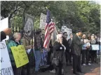  ??  ?? Protesters rally against Virginia Gov. Ralph Northam outside the governor’s mansion Monday in Richmond, Va.