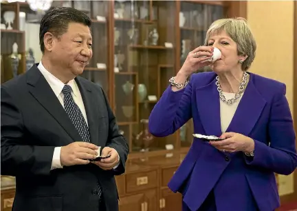  ?? PHOTO: GETTY IMAGES ?? British Prime Minister Theresa May and Chinese President Xi Jinping take part in a tea ceremony yesterday, during May’s three-day visit to China.