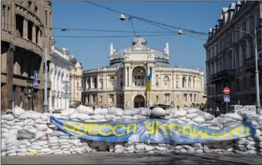  ?? (File Photo/AP/Petros Giannakour­is) ?? Sandbags block a street March 24 in front of the National Academic Theatre of Opera and Ballet building as a preparatio­n for a possible Russian offensive in Odesa.