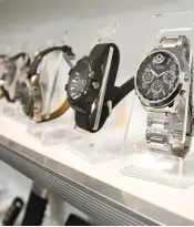 ??  ?? Wristwatch­es installed with hidden cameras on display at a spy camera shop. — AFP photos