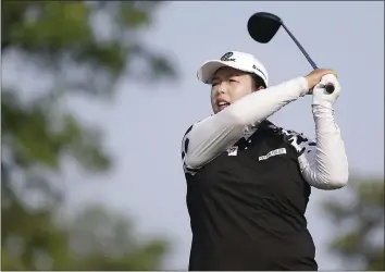  ?? SETH WENIG – THE ASSOCIATED PRESS ?? China’s Shanshan Feng tees off on the 13th hole during the first round of the U.S. Women’s Open on Thursday. Feng has a one-shot lead, but lightning delayed the round, which will be completed today.