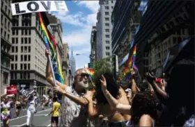  ?? THE ASSOCIATED PRESS ?? Steven Menendez blows a kiss while participat­ing in the New York City Pride Parade on Sunday in New York.