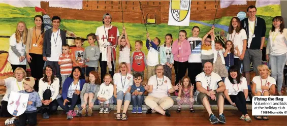  ??  ?? Flying the flag Volunteers and kids at the holiday club