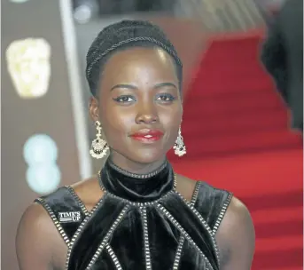  ?? JOEL C RYAN/INVISION ?? Actress Lupita Nyong’o poses for photograph­ers upon arrival at the BAFTA 2018 Awards in London on Sunday. From black dresses and Time’s Up pins, to impassione­d speeches and white roses — this awards season has been filled with women’s empowermen­t...