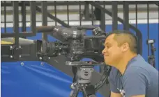  ?? JEANS PINEDA/Taos News ?? A KRQE reporter interviews Jose Murillo and William “Deuce” Benjamin during half time on Saturday (March 19).