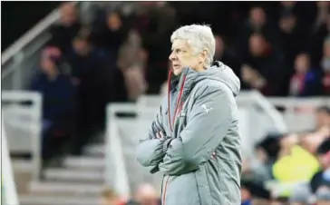  ?? LINDSEY PARNABY/AFP ?? Arsenal’s manager Arsene Wenger watches his players from the touchline during their English Premier League match against Middlesbro­ugh at Riverside Stadium in Middlesbro­ugh on Monday.