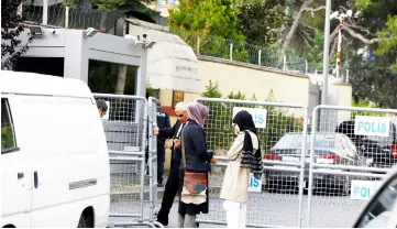  ??  ?? Khashoggi’s fiancee (left) and her friend wait outside Saudi Arabia’s consulate in Istanbul, Turkey. — Reuters photo