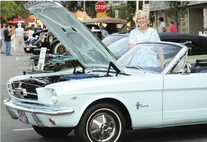  ?? SUN-TIMES FILE ?? Gail Wise of Park Ridge stands at a 2011 car show with the Ford Mustang she bought new in 1964.