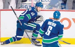  ?? JONATHAN HAYWARD THE CANADIAN PRESS ?? Vancouver Canucks forwards Elias Pettersson, 20, and Brock Boeser, 21, are part of a wave of young players who are making an impact on the league this season.