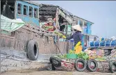  ?? AFP ?? A vendor sells vegetables in a canal off the Song Hau river at the floating Cai Rang market in Can Tho city.