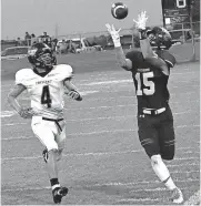  ?? [PHOTO BY TYLER DRABEK, FOR ?? Cashion’s Seth Brown catches a pass along the sideline as Crescent’s Josiah Lovett defends during Friday night’s high school football game in Cashion.