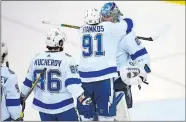  ?? NICK WASS/AP PHOTO ?? Lightning center Steven Stamkos (91) hugs goaltender Andrei Vasilevski­y (88) after Game 4 of the NHL Eastern Conference finals against the Capitals on Thursday.