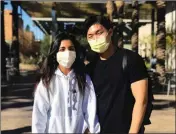  ?? GRISELDA ZETINO/KTAR NEWS 92.3 VIA AP ?? ARIZONA STATE UNIVERSITY STUDENTS Dayana Henriquez (left) and Daniel Oh wear masks while on campus in Tempe on Tuesday. A confirmed case of a virus outbreak from China at Arizona State University has left students feeling alarmed, despite the school’s attempts to tamp down panic.