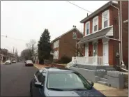  ?? EVAN BRANDT — MEDIANEWS GROUP ?? The owner of the house at right, 31 E. Fifth St., in Pottstown, wants to convert the property into an Airbnb. Concerns about street parking, shown at 1 p.m. Tuesday, convinced council to oppose the variance request.