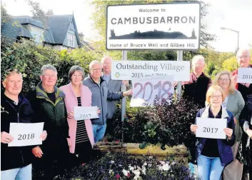  ??  ?? Four in a row Greener Cambusbarr­on volunteers in celebrator­y mood after award