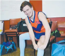  ??  ?? Right: Buln Buln footballer Mitchell Park pulls on the blue socks as part of the mental health round fixture against Nyora on Saturday.