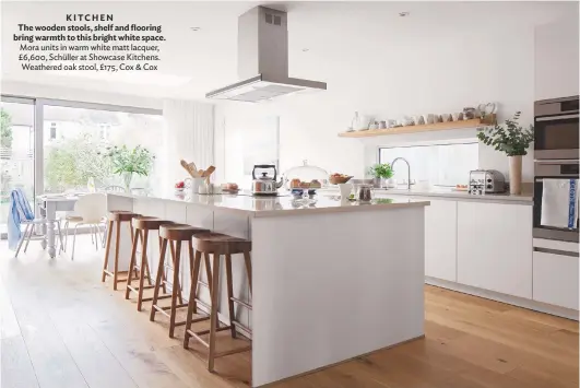  ??  ?? KITCHEN The wooden stools, shelf and flooring bring warmth to this bright white space. Mora units in warm white matt lacquer, £6,600, Schüller at Showcase Kitchens. Weathered oak stool, £175, Cox & Cox