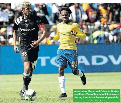  ?? /VELI NHLAPO ?? Abbubaker Mobara of Orlando Pirates and Percy Tau of Mamelodi Sundowns during their Absa Premiershi­p match.