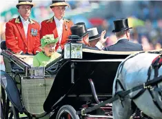  ??  ?? The Queen’s Ascot Landau driven down the course to the parade ring before the racing