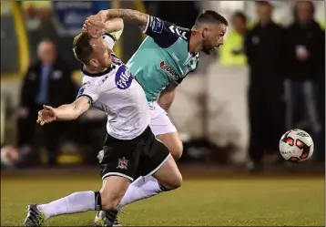  ??  ?? Rory Patterson of Derry City tries to escape the clutches of Stephen O’Donnell.