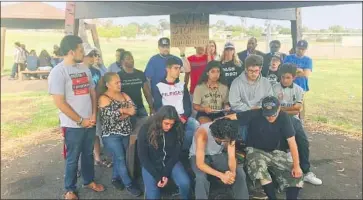  ?? Alex Riggins San Diego Union-Tribune ?? A 16-YEAR-OLD GIRL and others speak to reporters Friday at SDG&amp;E Park in Chula Vista, where a video of a confrontat­ion between police officers and students shows one officer forcefully taking her to the ground.