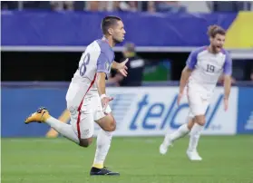  ?? AP FOTO ?? NO. 57. Clint Dempsey celebrates his 82nd minute goal in the Gold Cup.