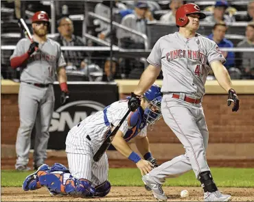  ?? BILL KOSTROUN / ASSOCIATED PRESS ?? The Reds’ Scott Schebler strikes out as Mets catcher Travis d’Arnaud reaches for the ball in the ninth inning of New York’s win Friday night.