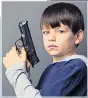  ??  ?? SHOCK: Kids with guns