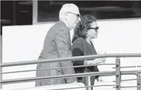  ?? JOSHUA MCKERROW/BALTIMORE SUN MEDIA ?? Judge Devy Patterson Russell, right, seen with her lawyer, William Brennan, continued to hear cases for seven months while she waited for a decision in her disciplina­ry case.