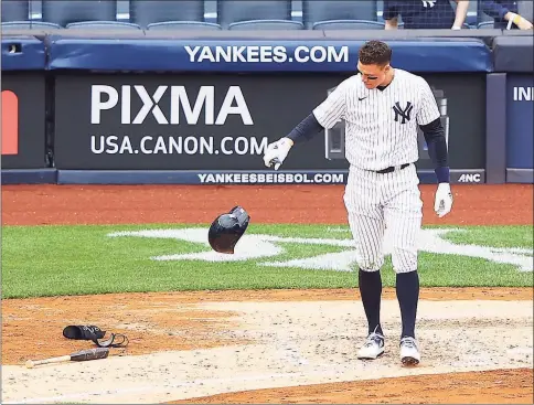  ?? Mike Stobe / Getty Images ?? The Yankees’ Aaron Judge reacts after striking out to end the fifth inning against the Rays on Sunday.