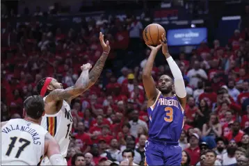  ?? GERALD HERBERT — THE ASSOCIATED PRESS ?? Suns guard Chris Paul (3) shoots over Pelicans forward Brandon Ingram in the second half of Game 6of a first-round playoff series on Thursday in New Orleans. The Suns won 115-109, to win the series 4-2and advance to the second-round.
