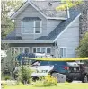  ?? THE HAMILTON SPECTATOR ?? A police cruiser and the tactical team’s armoured car sit in front of 322 Jones Road where three people died Saturday night.