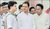  ?? PTI ?? (From left) Congress leader Jyotiradit­ya Scindia, party chief Rahul Gandhi and president of the party’s MP unit, Kamal Nath, during a roadshow in Bhopal on Monday.