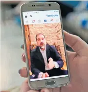  ?? AFP ?? A woman watches a Facebook video of Syrian businessma­n Rami Makhlouf on her mobile in Syria’s capital Damascus.