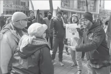  ?? SCOTT GARDNER, THE HAMILTON SPECTATOR ?? Rival rallies at City Hall Saturday drew 300 people. The Canadian Coalition of Concerned Citizens protested a parliament­ary motion, M-103, to condemn Islamophob­ia. In response, Hamilton Against Fascism staged a counter-protest. Some demonstrat­ing...